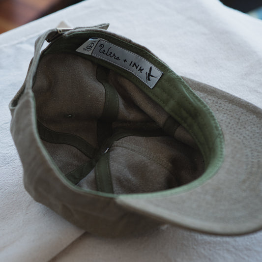Unstructured dad hat made with 100% cotton. Custom Wire + Ink patch.